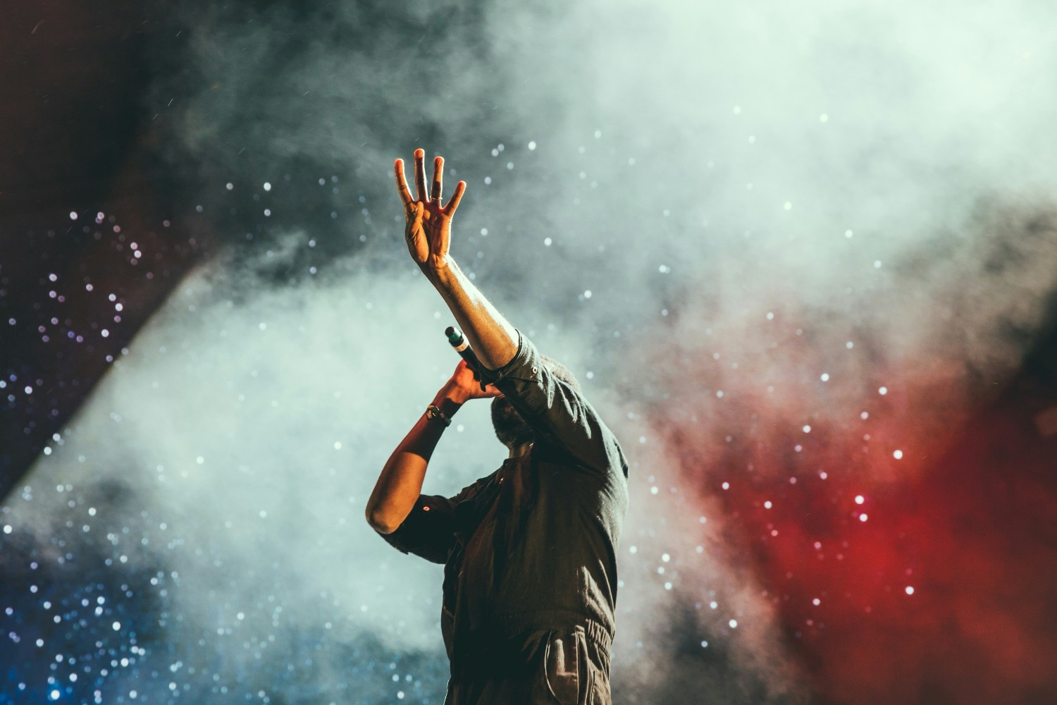 A singer reaching out to the crowd at Wilderness Festival