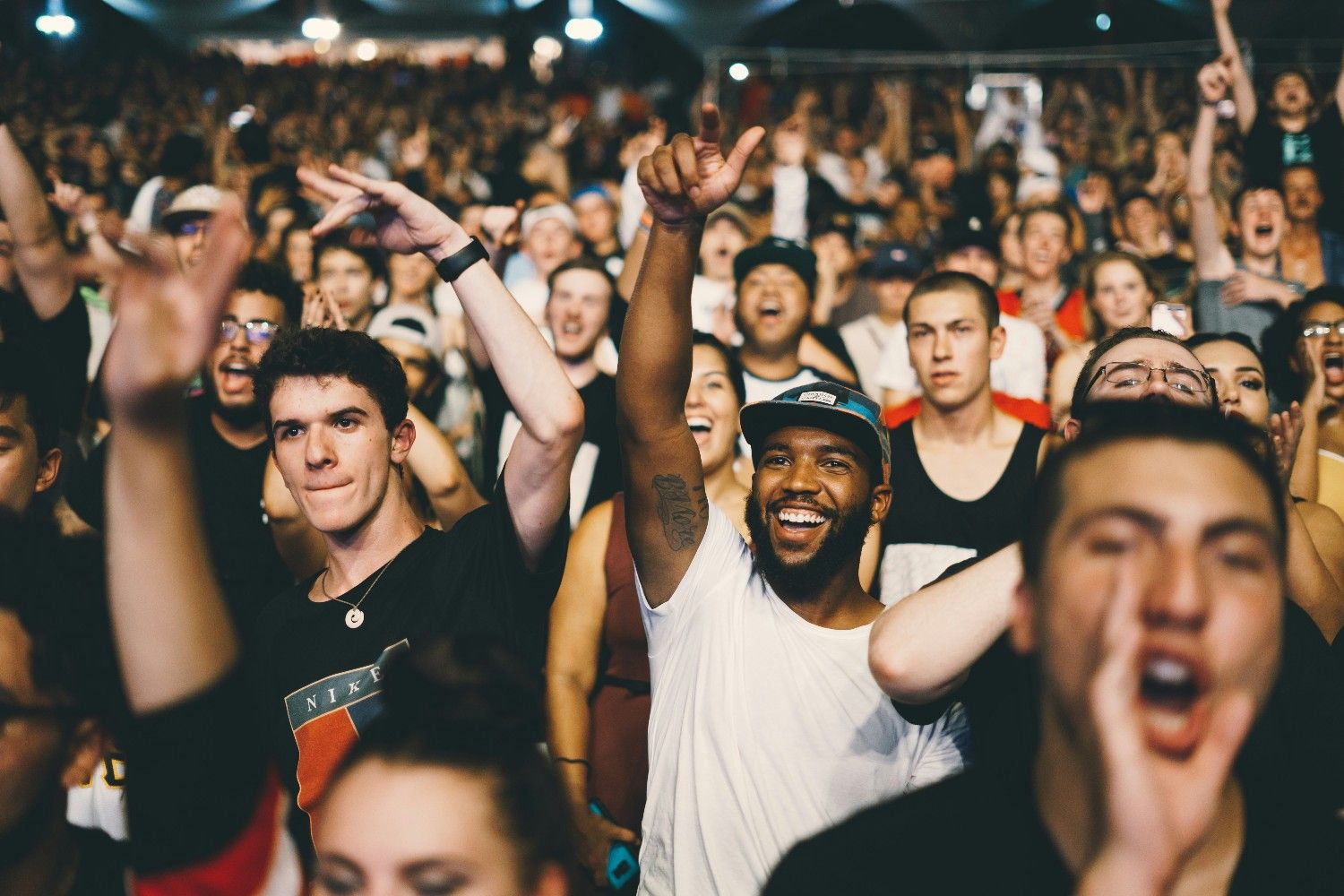 People smiling in the crowd at Wilderness