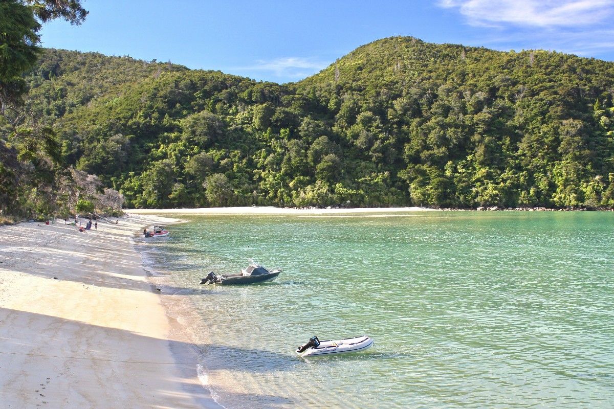 An image of boats on the beach in Abel Tasman National Park 