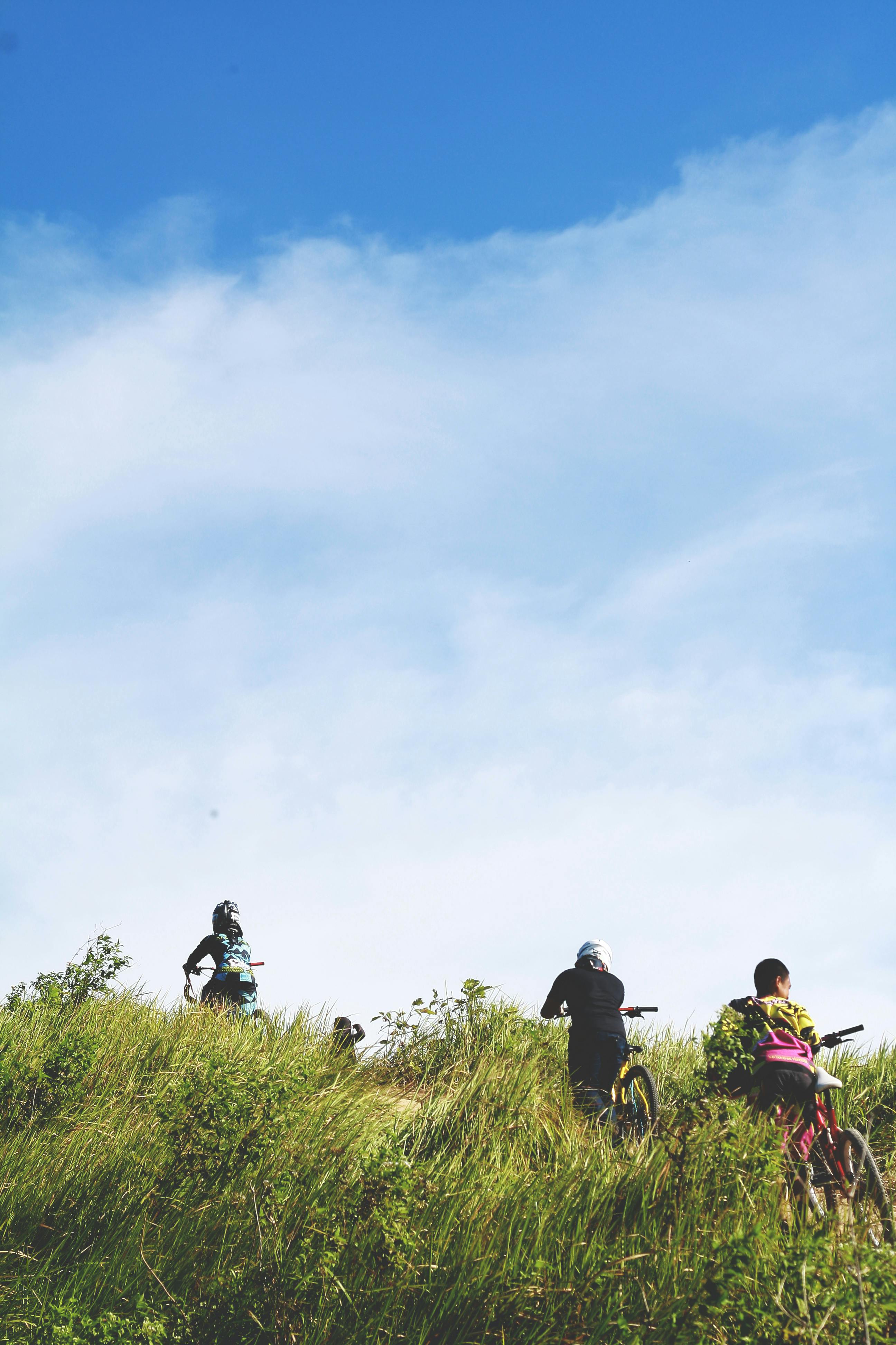 People mountain biking 