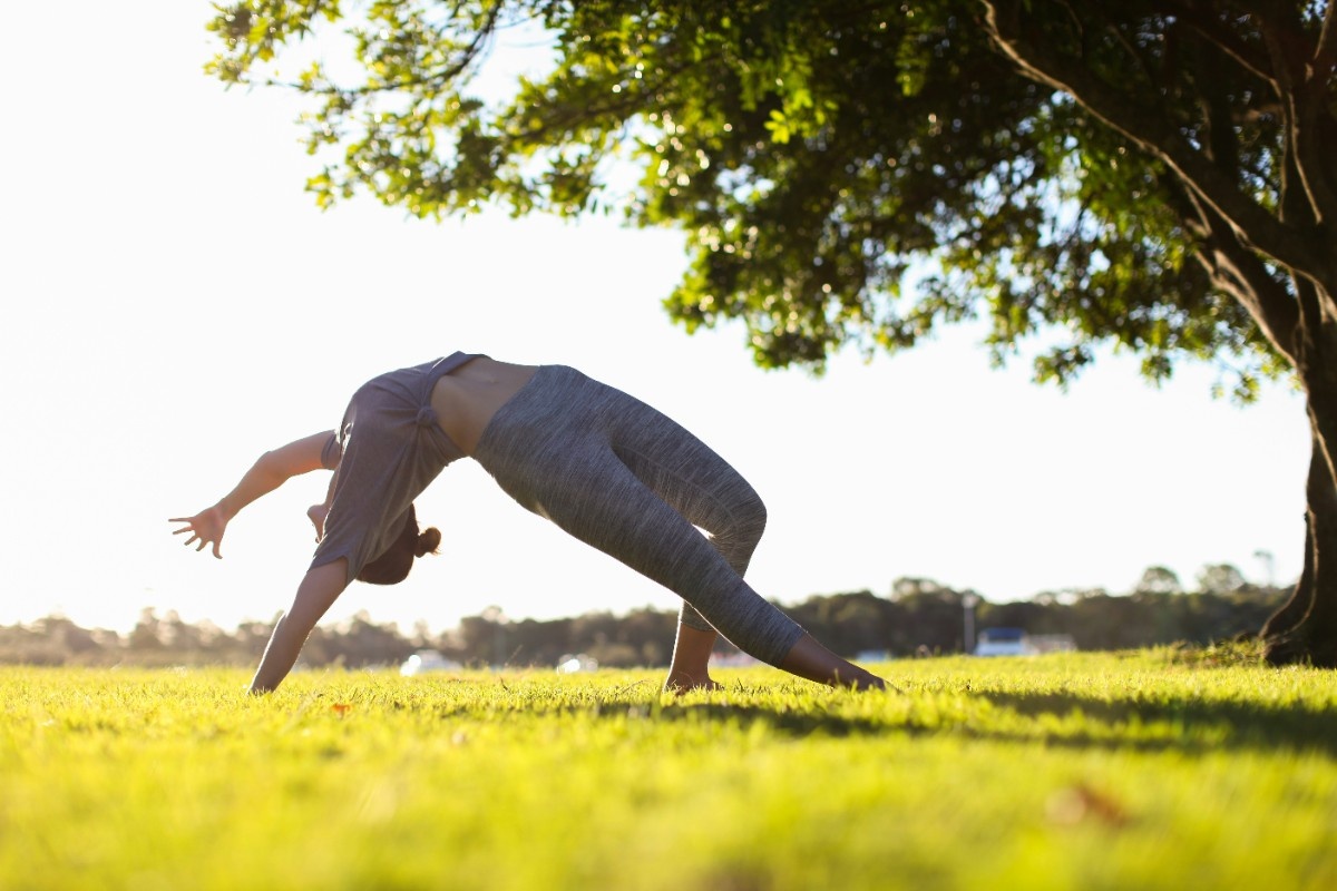 A woman doing outdoor yoga