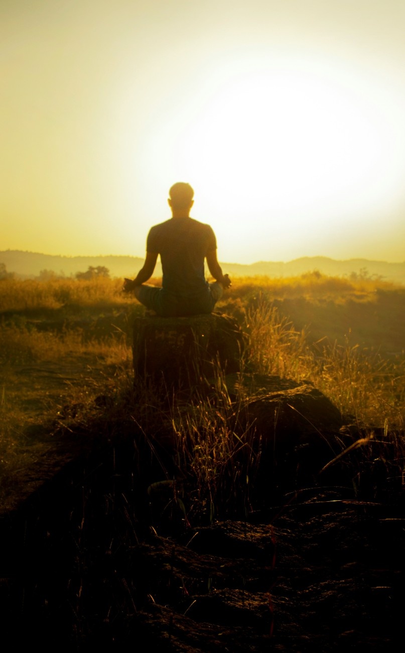 A man doing outdoor yoga