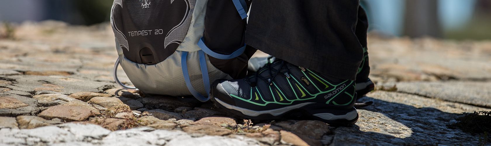 A person wearing salomon walking shoes 