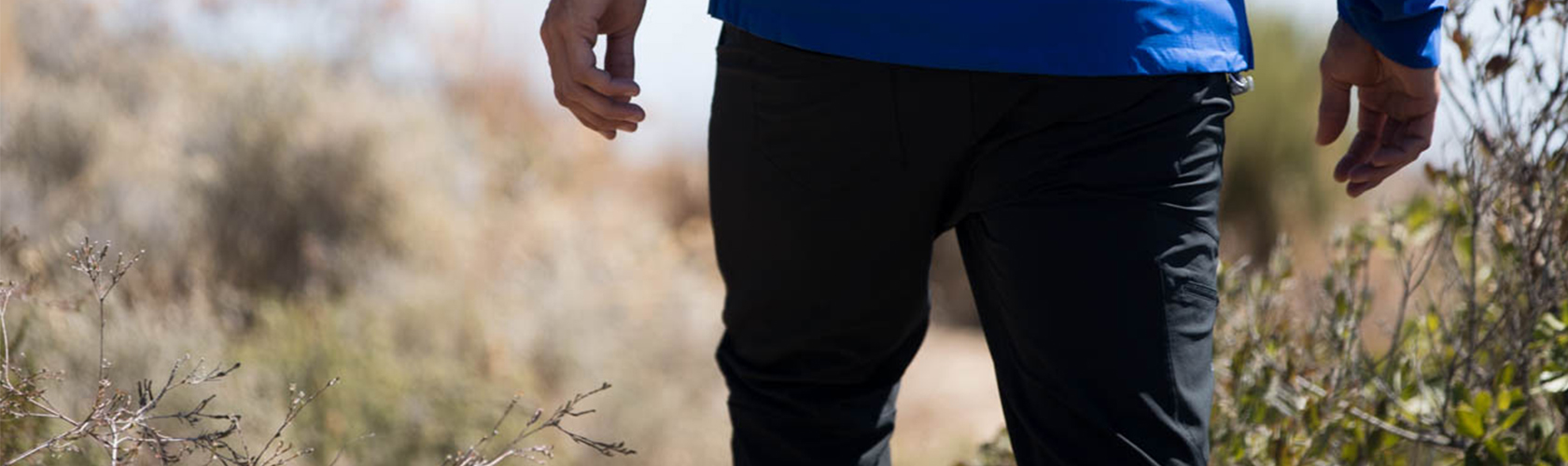 A person wearing walking trousers 